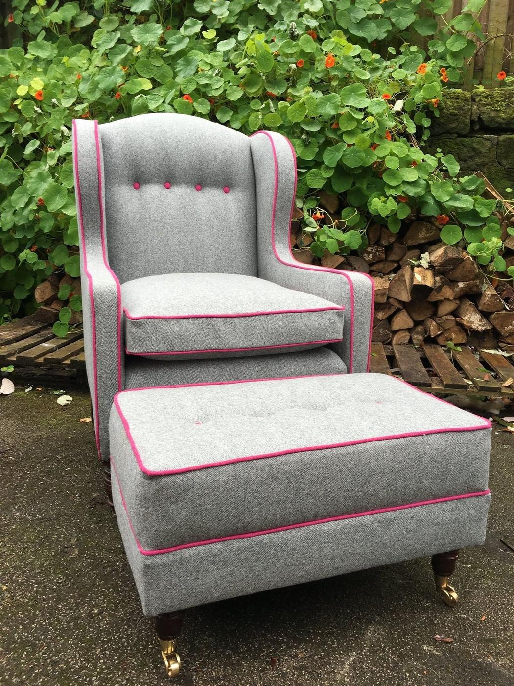 Grey wing chair and footstool with pink piping