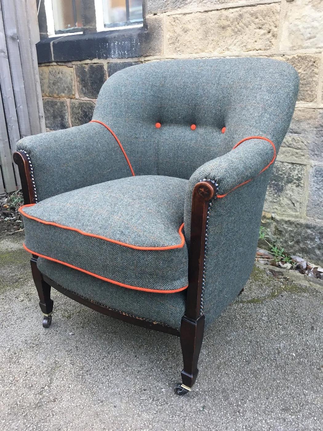 Grey tweed tub chair with orange piping